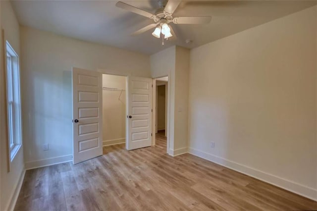 460 Ridge Point Dr, Monticello, GA 31064 - unfurnished bedroom featuring light wood-style flooring, baseboards, a closet, and ceiling fan