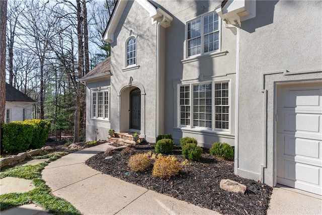 doorway to property with stucco siding