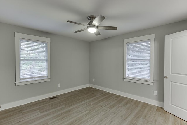 spare room with ceiling fan and light hardwood / wood-style floors