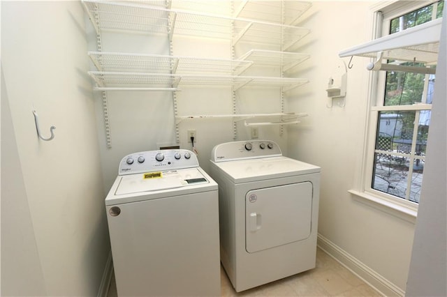 clothes washing area with washer and dryer