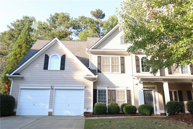 view of front of house with a garage and covered porch