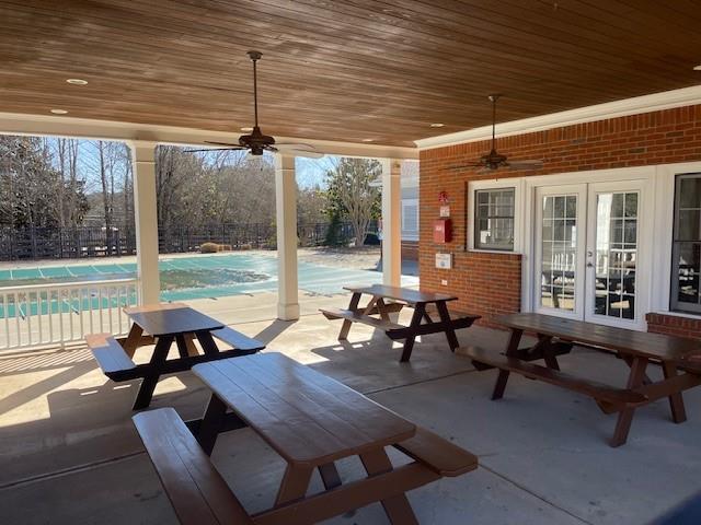 view of patio / terrace with ceiling fan and french doors