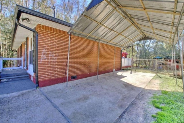 exterior space with a carport