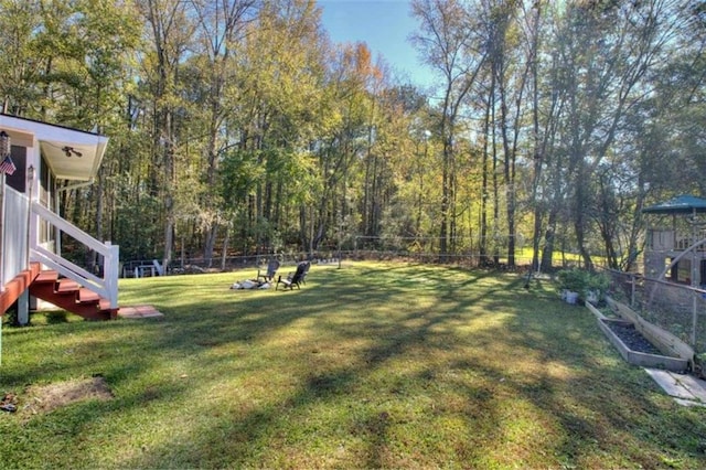 197 Dixboro Dr, Jonesboro, GA 30238 - view of yard featuring stairway and a view of trees