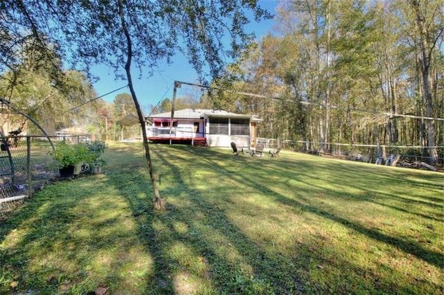 view of yard with a sunroom