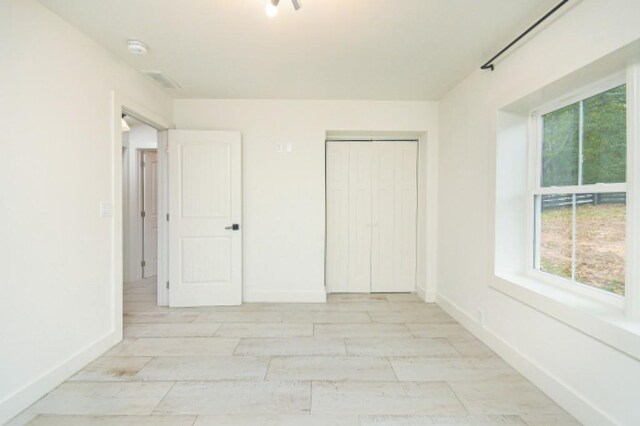 unfurnished bedroom featuring a closet