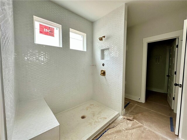 7040 Manchester Dr, Flowery Branch, GA 30542 - full bath featuring a shower stall and a spacious closet