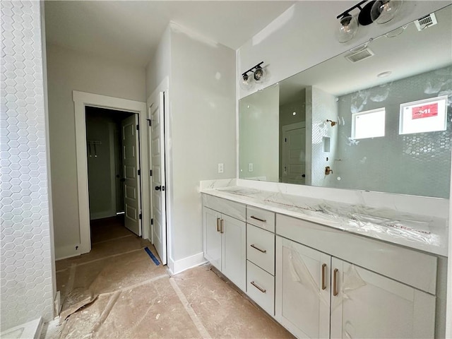 7040 Manchester Dr, Flowery Branch, GA 30542 - bathroom featuring double vanity and a shower