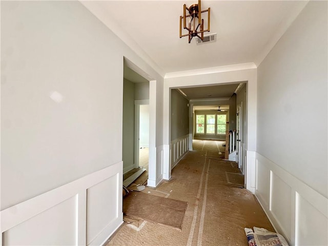 7040 Manchester Dr, Flowery Branch, GA 30542 - corridor with a chandelier and a wainscoted wall