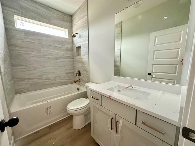 7040 Manchester Dr, Flowery Branch, GA 30542 - bathroom with wood finished floors, vanity, toilet, and  shower combination
