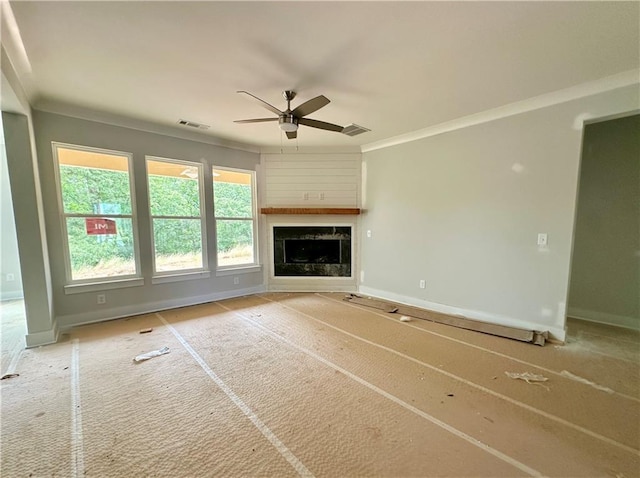 7040 Manchester Dr, Flowery Branch, GA 30542 - unfurnished living room with a ceiling fan, baseboards, a high end fireplace, and crown molding