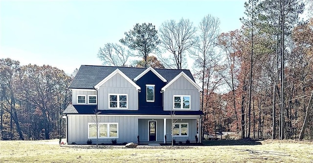 view of front of house featuring a porch and a front yard