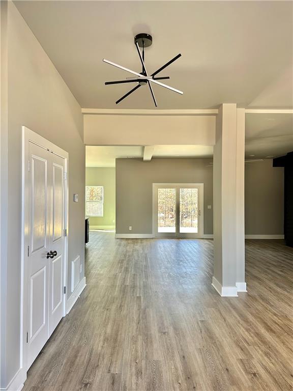 empty room with light hardwood / wood-style flooring