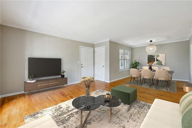 living room featuring crown molding and hardwood / wood-style floors