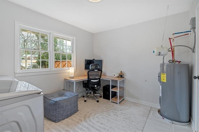 tiled office space featuring water heater and washer and dryer