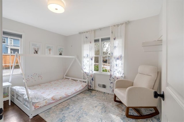 bedroom with hardwood / wood-style floors