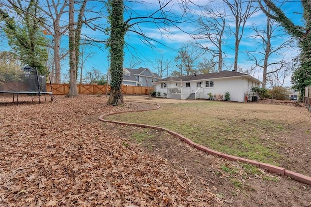 view of yard with a trampoline