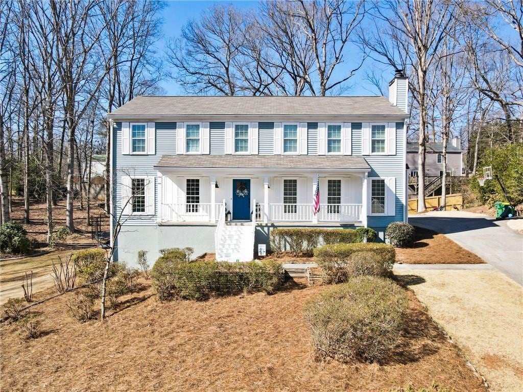 colonial home featuring a porch