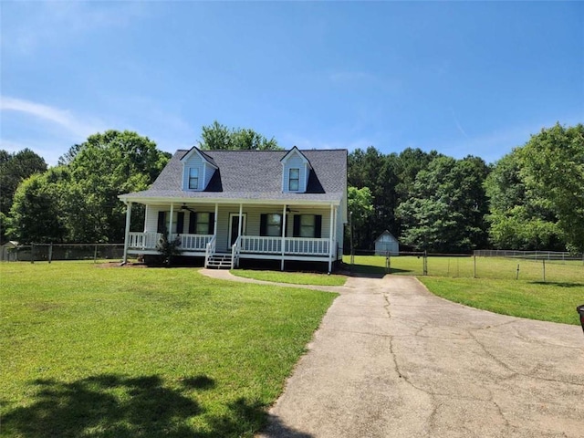 520 John Deere Rd, Monroe, GA 30656 - new england style home featuring a porch, concrete driveway, and a gate