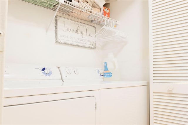 washroom featuring laundry area and independent washer and dryer