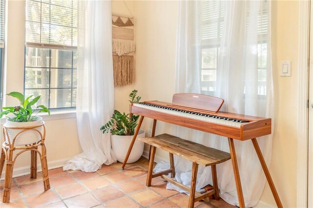 misc room with plenty of natural light and light tile patterned floors