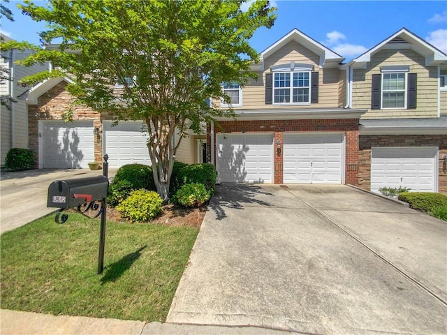 view of front of property with a garage and a front yard