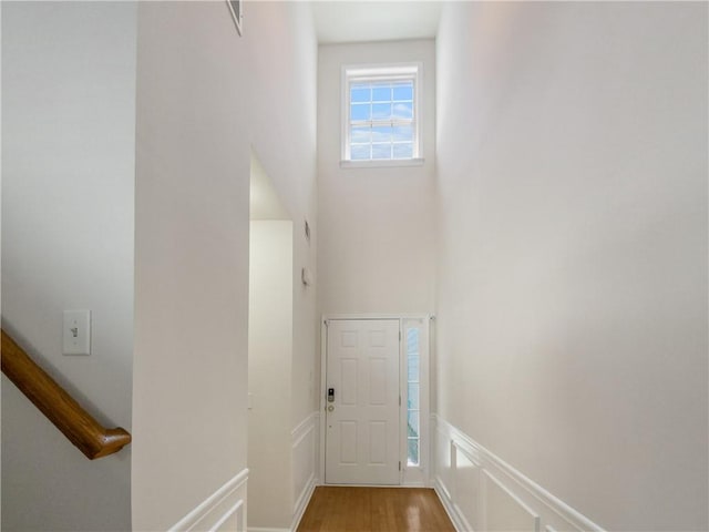 hallway with wood-type flooring