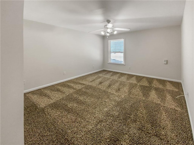 empty room with ceiling fan and carpet