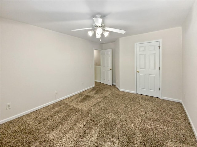 unfurnished bedroom featuring ceiling fan and carpet flooring