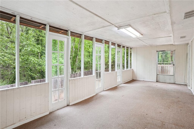 unfurnished sunroom featuring visible vents