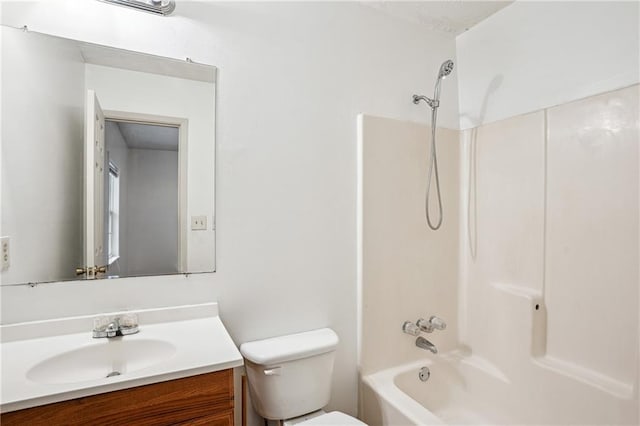 full bath with toilet, vanity, and  shower combination