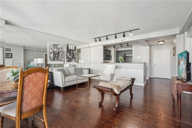 living room with dark hardwood / wood-style flooring