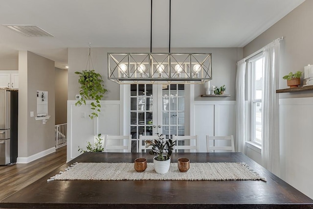 unfurnished dining area with french doors and hardwood / wood-style floors