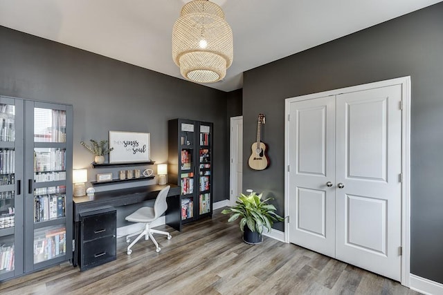 home office with hardwood / wood-style flooring