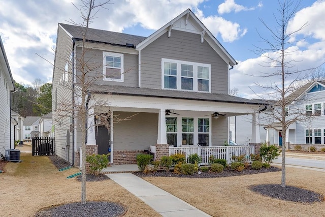 craftsman-style home featuring cooling unit, ceiling fan, and a porch