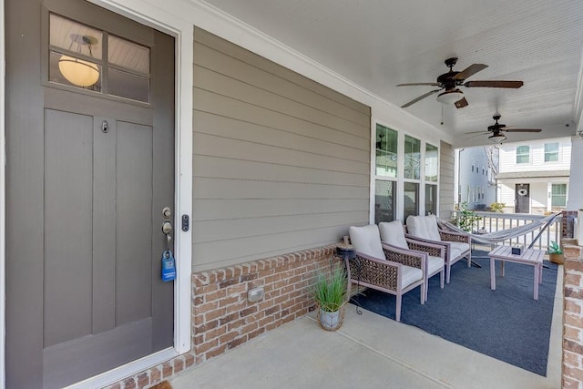 view of patio with ceiling fan and a porch