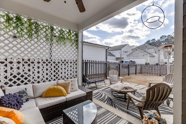 view of patio with ceiling fan and an outdoor living space