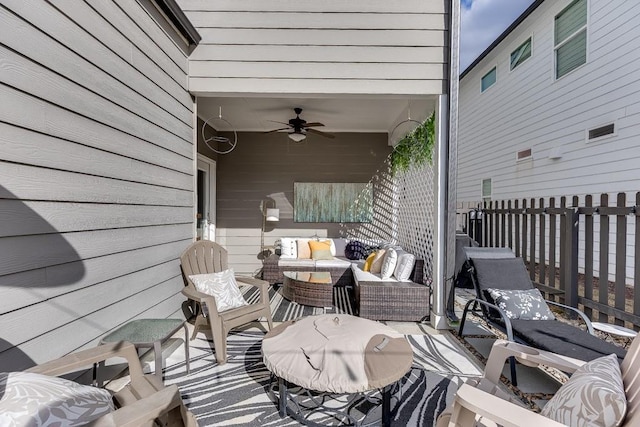 view of patio with ceiling fan and an outdoor hangout area