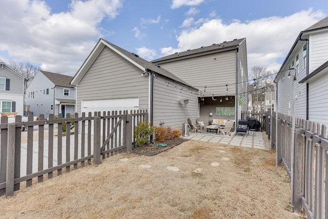 rear view of property with a patio area