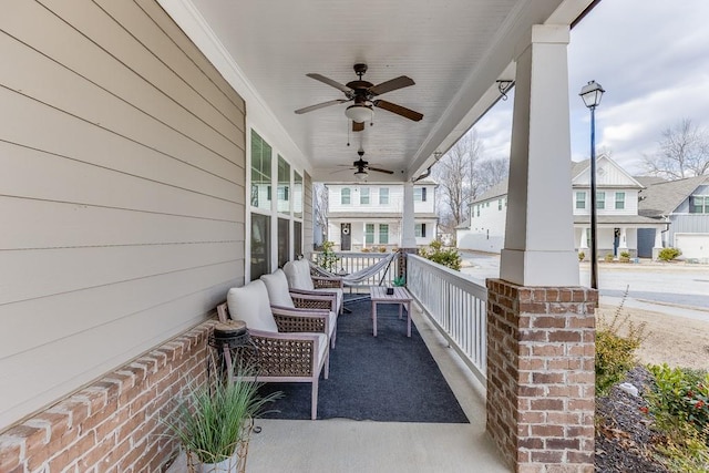 view of patio / terrace with ceiling fan and a porch