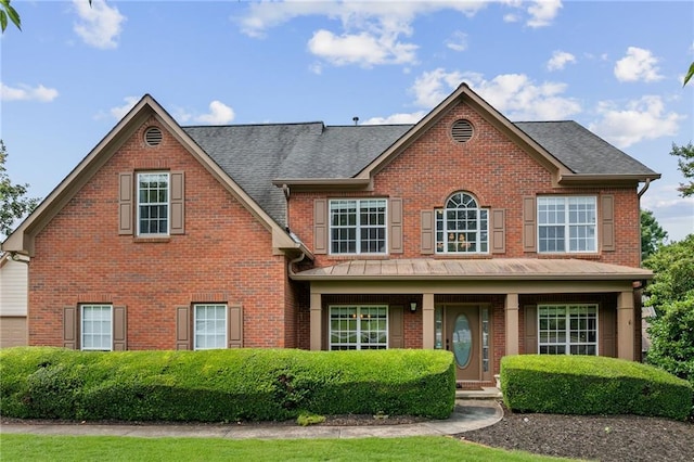 435 Ruby Forest Pkwy, Suwanee, GA 30024 - view of front of house with brick siding, a porch, and a shingled roof