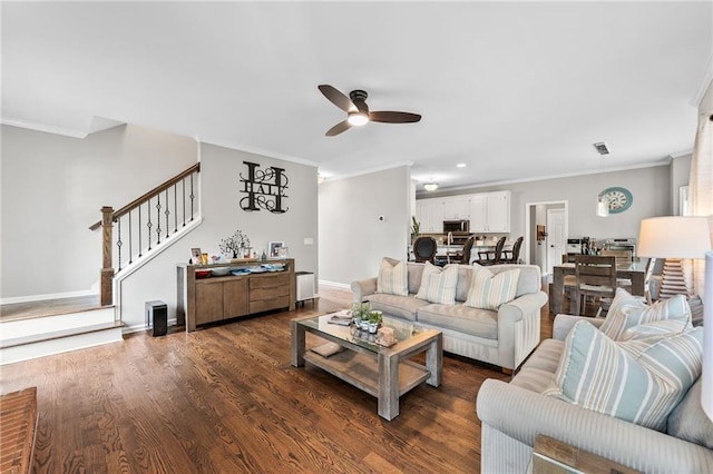435 Ruby Forest Pkwy, Suwanee, GA 30024 - living room with crown molding, ceiling fan, stairs, dark wood-style floors, and baseboards