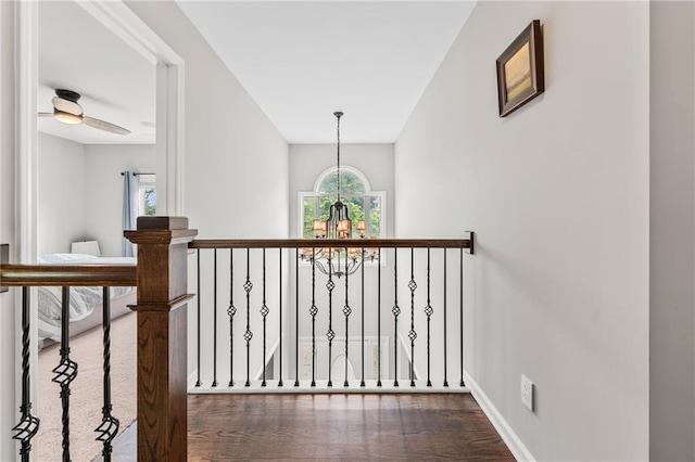 435 Ruby Forest Pkwy, Suwanee, GA 30024 - corridor with a chandelier, healthy amount of natural light, wood finished floors, and baseboards