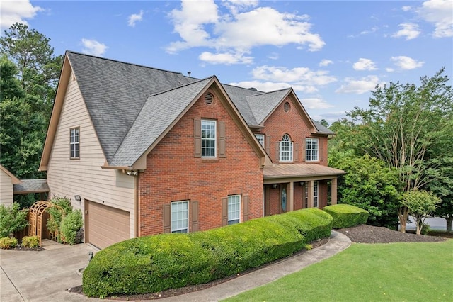435 Ruby Forest Pkwy, Suwanee, GA 30024 - view of front of home with brick siding, concrete driveway, a garage, and a front yard