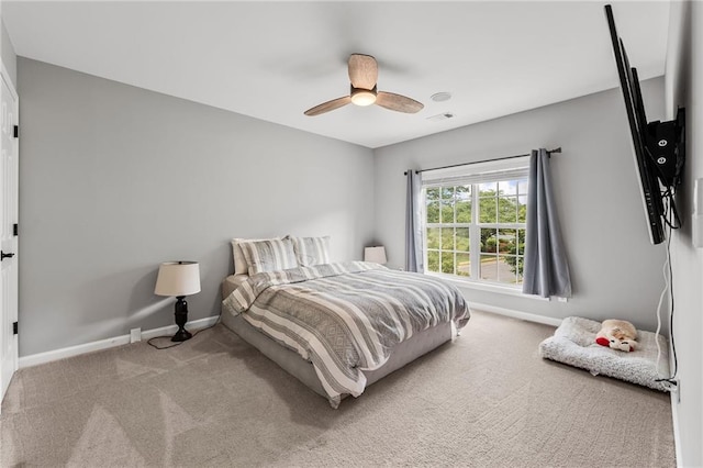 435 Ruby Forest Pkwy, Suwanee, GA 30024 - carpeted bedroom with baseboards and a ceiling fan