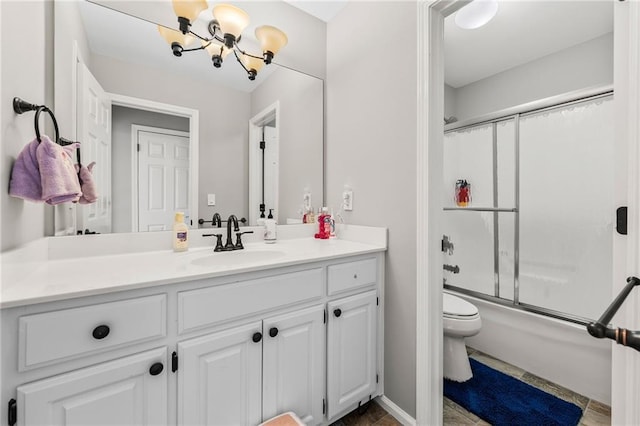435 Ruby Forest Pkwy, Suwanee, GA 30024 - bathroom featuring toilet, vanity, bath / shower combo with glass door, and a chandelier