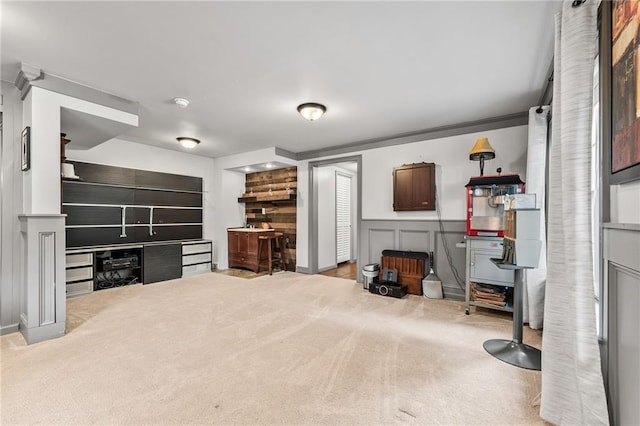 435 Ruby Forest Pkwy, Suwanee, GA 30024 - carpeted living area featuring a wainscoted wall
