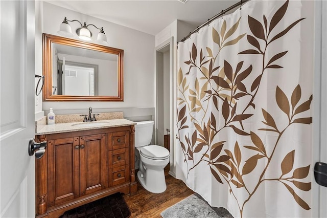 435 Ruby Forest Pkwy, Suwanee, GA 30024 - full bathroom with toilet, wood finished floors, vanity, and a shower with curtain