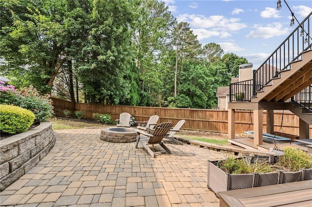 435 Ruby Forest Pkwy, Suwanee, GA 30024 - view of patio / terrace featuring stairs and a fire pit