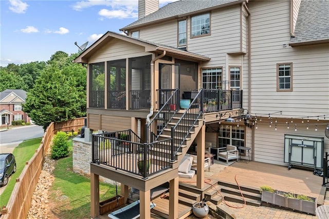 435 Ruby Forest Pkwy, Suwanee, GA 30024 - back of house with a deck, stairway, a sunroom, a chimney, and roof with shingles